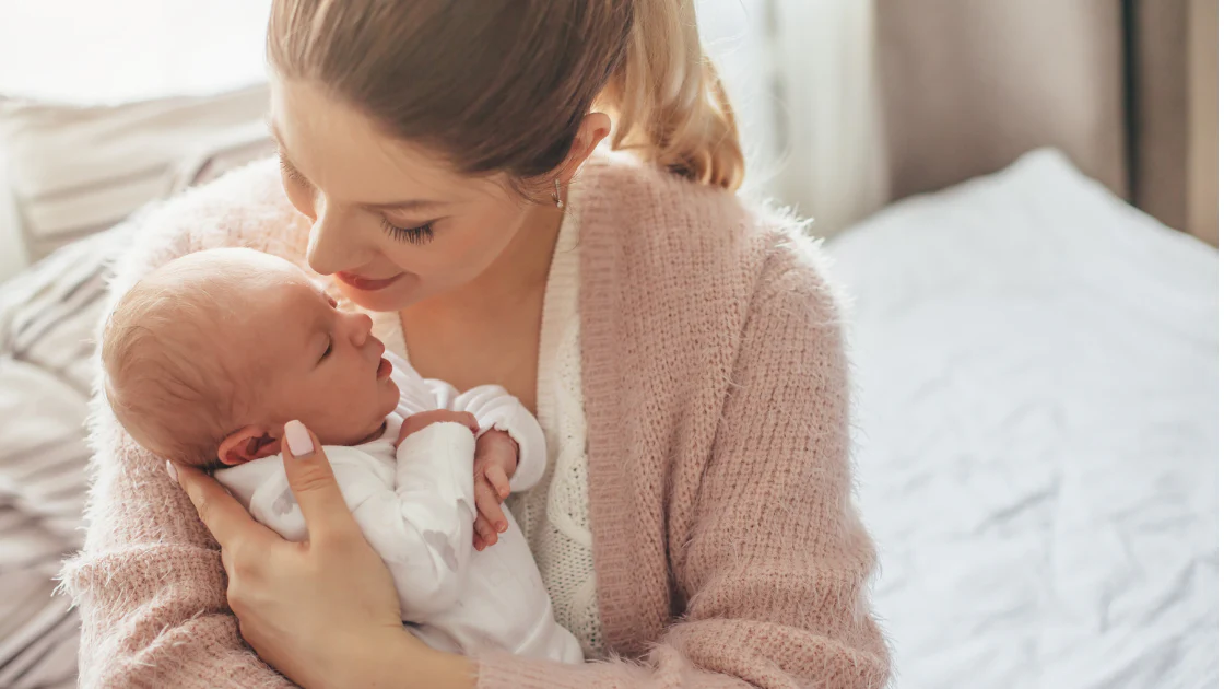 Mother holding newborn baby